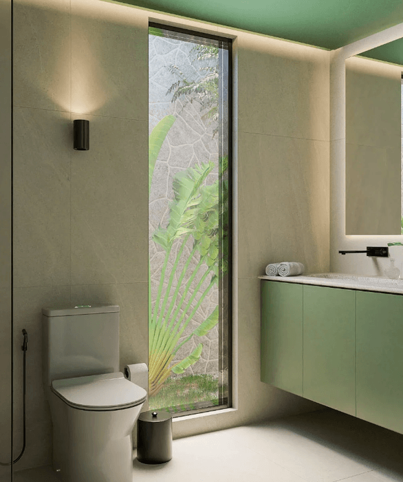 Lavabo em tons verdes com jardim externo emoldurado pela janela