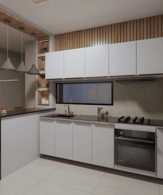 Bancada escura com cooktop e marcenaria branca sob janela horizontal